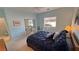 Bedroom setup with a corner view showing the bed, desk, and window at 720 Florida St, Pahrump, NV 89048