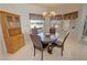 Cozy breakfast nook with a wooden dining set, window views, and a decorative hutch at 720 Florida St, Pahrump, NV 89048