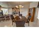 Bright dining area featuring a wood table and a view into the adjacent kitchen at 720 Florida St, Pahrump, NV 89048