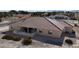 Backyard view with a covered patio and desert landscaping at 720 Florida St, Pahrump, NV 89048