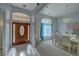 Spacious foyer leading into the dining area featuring an elegant chandelier at 720 Florida St, Pahrump, NV 89048