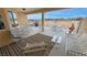 Relaxing covered patio featuring outdoor furniture, a grill, and a scenic view at 720 Florida St, Pahrump, NV 89048