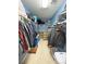 Spacious walk-in closet with lots of storage, shelving, and neatly organized clothes at 720 Florida St, Pahrump, NV 89048