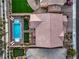 Aerial view of a home featuring a backyard pool, putting green, and well-manicured landscaping, offering a luxurious outdoor space at 7411 Zonal Ave, Las Vegas, NV 89131