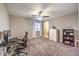 Spacious carpeted bedroom with ceiling fan, desk and dresser, and natural light at 7411 Zonal Ave, Las Vegas, NV 89131