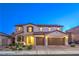 Stunning two-story home with a three-car garage and beautiful desert landscaping at 7411 Zonal Ave, Las Vegas, NV 89131