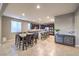 Open floor plan featuring a dining area and kitchen, with stainless steel appliances and tile flooring at 7411 Zonal Ave, Las Vegas, NV 89131