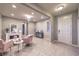 Cozy living room showcasing an elegant chandelier, fireplace, and tile flooring at 7411 Zonal Ave, Las Vegas, NV 89131