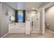 Well-lit main bathroom showcases a soaking tub with a shower and a separate glass-enclosed shower at 7411 Zonal Ave, Las Vegas, NV 89131