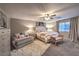 Relaxing main bedroom boasts soft lighting, decorative accents, neutral walls, and a comfortable upholstered bed at 7411 Zonal Ave, Las Vegas, NV 89131