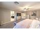 Spacious main bedroom featuring neutral walls, soft lighting, decorative accents, and a stylish upholstered bed at 7411 Zonal Ave, Las Vegas, NV 89131