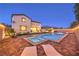 Backyard pool, hot tub, and patio with lounge chairs, creating a private outdoor retreat for relaxation and entertainment at 7411 Zonal Ave, Las Vegas, NV 89131