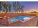 Backyard pool with tanning deck, lounge chairs and manicured lawn, set against a backdrop of trees and mountains at 7411 Zonal Ave, Las Vegas, NV 89131