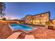 Backyard pool and patio of a two-story home, with lounge chairs, manicured lawn, and outdoor seating area at 7411 Zonal Ave, Las Vegas, NV 89131