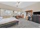 Bedroom with vaulted ceilings, ceiling fan, and an ensuite bathroom at 7520 Cobal Canyon Ln, Las Vegas, NV 89129