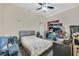 Bedroom with a gray padded headboard, and clutter at 7520 Cobal Canyon Ln, Las Vegas, NV 89129