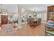 Elegant dining area with tile flooring adjacent to the game room, perfect for entertaining guests at 7520 Cobal Canyon Ln, Las Vegas, NV 89129