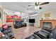 Bright and airy living room with a fireplace and seamless flow to the kitchen at 7520 Cobal Canyon Ln, Las Vegas, NV 89129