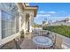 Cozy outdoor patio area perfect for relaxing, featuring comfortable seating and serene neighborhood views at 7520 Cobal Canyon Ln, Las Vegas, NV 89129