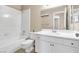 Clean bathroom featuring a tiled tub/shower, toilet, and vanity with a sink and mirror at 7624 Desert Delta Dr, Las Vegas, NV 89128