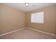 Neutral bedroom featuring a window with blinds and plush carpeting at 7624 Desert Delta Dr, Las Vegas, NV 89128