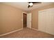 Bedroom featuring a closet with double doors, ceiling fan, neutral walls, and carpeted floors at 7624 Desert Delta Dr, Las Vegas, NV 89128