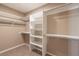 Spacious walk-in closet with carpet and custom shelving at 7624 Desert Delta Dr, Las Vegas, NV 89128