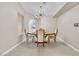 Cozy dining area with modern lighting, neutral walls, and tile flooring at 7624 Desert Delta Dr, Las Vegas, NV 89128