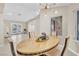 Dining area with modern lighting fixture and views of living room and back yard at 7624 Desert Delta Dr, Las Vegas, NV 89128