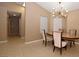 Elegant dining room with modern light fixture at 7624 Desert Delta Dr, Las Vegas, NV 89128