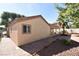 Exterior home elevation highlighting brick pavers, stucco and a covered patio at 7624 Desert Delta Dr, Las Vegas, NV 89128