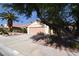 Charming single-story home with a well-maintained front yard and large driveway at 7624 Desert Delta Dr, Las Vegas, NV 89128