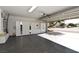 Spacious garage includes an organization system and epoxy floor at 7624 Desert Delta Dr, Las Vegas, NV 89128