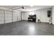 This clean garage is equipped with smooth floors and garage doors, offering ample space for vehicles and projects at 7624 Desert Delta Dr, Las Vegas, NV 89128