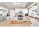 Well-designed kitchen featuring stainless appliances, white cabinets, and ample countertop space, ideal for cooking at 7624 Desert Delta Dr, Las Vegas, NV 89128