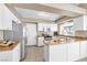 Bright kitchen with stainless appliances and white cabinets providing ample storage and cooking space at 7624 Desert Delta Dr, Las Vegas, NV 89128