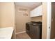 Laundry room featuring modern side-by-side appliances at 7624 Desert Delta Dr, Las Vegas, NV 89128