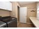 Laundry room featuring modern appliances and built-in counter at 7624 Desert Delta Dr, Las Vegas, NV 89128