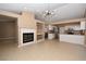 Open living space with fireplace and modern kitchen at 7624 Desert Delta Dr, Las Vegas, NV 89128