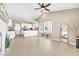 Large living room featuring tile floors, bright windows, and modern decor, perfect for entertaining or relaxing at 7624 Desert Delta Dr, Las Vegas, NV 89128