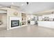 Bright living room featuring a fireplace and built-in shelves, providing a cozy yet organized space at 7624 Desert Delta Dr, Las Vegas, NV 89128