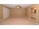 Spacious main bedroom with ensuite bathroom and neutral carpeting at 7624 Desert Delta Dr, Las Vegas, NV 89128