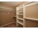 Walk-in closet with shelving and bars for hanging clothes at 7624 Desert Delta Dr, Las Vegas, NV 89128