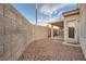 The backyard features a gravel yard with a covered patio at 7728 White Flower Ct, Las Vegas, NV 89131