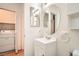 Bathroom featuring a single sink vanity with laundry hookups nearby at 7728 White Flower Ct, Las Vegas, NV 89131