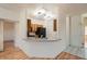 Bright kitchen features a breakfast bar with stainless steel sink and modern lighting at 7728 White Flower Ct, Las Vegas, NV 89131