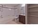 A practical bathroom featuring a combined tub and shower, single sink vanity, and built-in shelving at 7885 W Flamingo Rd # 1016, Las Vegas, NV 89147