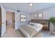 Modern bedroom featuring a neutral color palette, decorative prints, and a comfortable-looking bed with stylish linens at 7885 W Flamingo Rd # 1016, Las Vegas, NV 89147