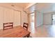 Dining area with closet and view into the living room area through an opening to the living area at 7885 W Flamingo Rd # 1016, Las Vegas, NV 89147