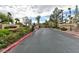 The secure entrance to the Rancho Viejo community features manicured landscaping and neighborhood signage at 7885 W Flamingo Rd # 1016, Las Vegas, NV 89147